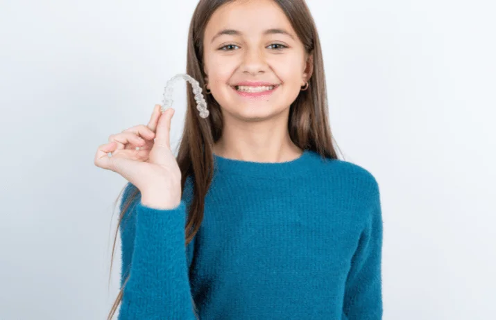 girl_holding_clear_braces